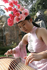 Girl playing traditional guzheng