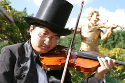 Violin player and Strauss statue, Austria garden