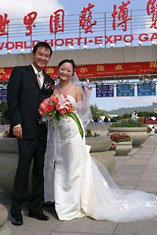 Bride and bridegroom by Expo entrance