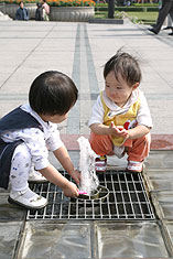 Children playing in fountain, Zhongxin Square