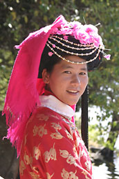Mosuo girl in traditional costume, Lugu Lake