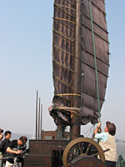 Peter hauling up junk mainsail