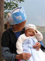 Old Zhuang woman and baby in Ping'an village, Longsheng