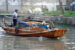 Old couple on canal boat, Tongli