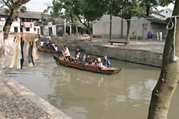Tourists being taken on a canal boat trip, Tongli