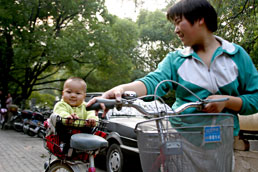 Baby in bicycle shopping basket, Wuxi